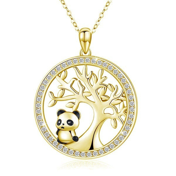 Gold pendant with panda design and tree of life on a white background