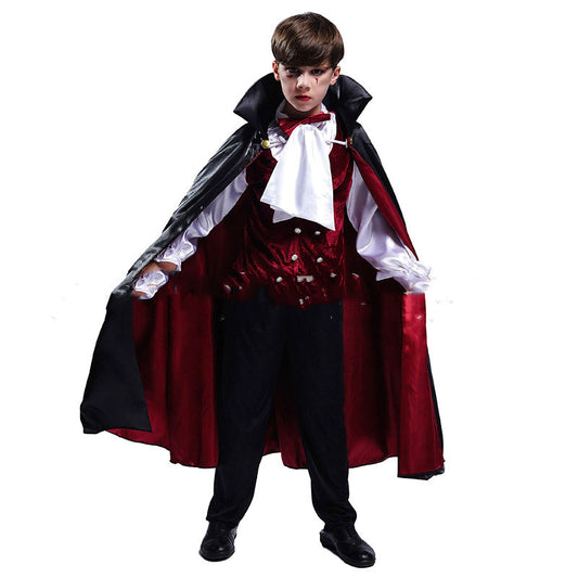 Child wearing a vampire costume with a red cape and black outfit on a white background