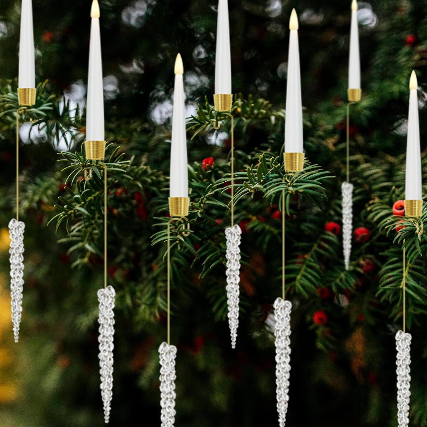 Decorative candles with crystal balls hanging on a Christmas tree.a Christmas tree background.