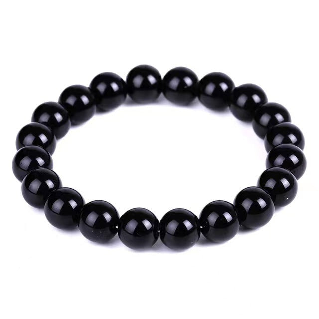 Black beaded bracelet on a white background