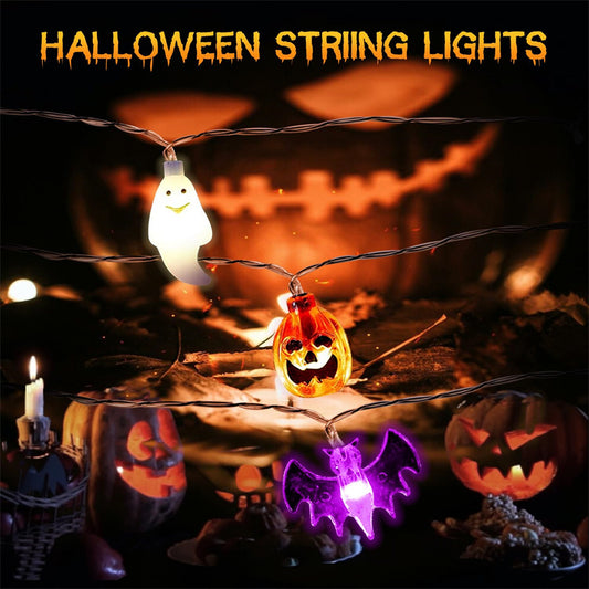 Halloween string lights with ghost, pumpkin, and bat designs on a dark background.
